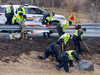 RCMP investigators search for evidence at the location where Const. Heidi Stevenson was killed by a mass shooter along the highway in Shubenacadie, N.S. on April 23, 2020.