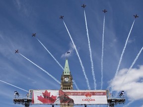 The Royal Canadian Air Force Snowbirds fly past the Peace Tower during the Canada Day noon show on Parliament Hill in Ottawa on Monday, July 1, 2019. The Canadian Armed Forces is deploying its famed Snowbirds aerobatics team will be launching a cross-country tour aimed at boosting morale as Canadians continue to struggle with the COVID-19 pandemic.