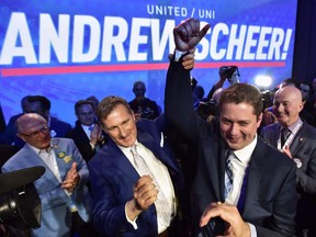 Andrew Scheer, right, is congratulated by Maxime Bernier after being elected the new leader of the federal Conservative party at the federal Conservative leadership convention in Toronto on Saturday, May 27, 2017.