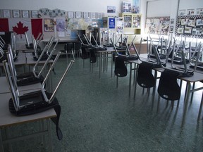 A empty classroom is pictured at Eric Hamber Secondary school in Vancouver, B.C. Monday, March 23, 2020. British Columbia's education minister says he wants to learn from other provinces and countries like New Zealand before starting to reopen schools.