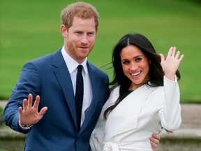In this file photo taken on November 27, 2017 Britain's Prince Harry and his fiancée US actress Meghan Markle pose for a photograph in the Sunken Garden at Kensington Palace in west London following the announcement of their engagement. - The Duke and Duchess of Sussex have told the UK's tabloid press they are ending all co-operation with them on April 20, 2020.