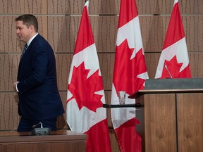 Conservative Leader Andrew Scheer leaves the podium at the end of a news conference on April 23, 2020 in Ottawa.