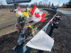 A memorial pays tribute to shooting victim RCMP Const. Heidi Stevenson along the highway in Shubenacadie, N.S. on April 21, 2020.