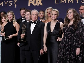 The cast of Saturday Night Live poses backstage on September 22, 2019, with their award for Outstanding Variety Sketch Series at the Primetime Emmy Awards.