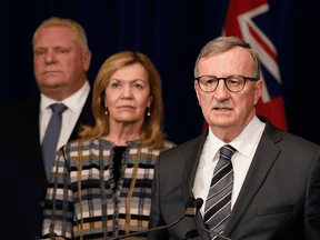 Dr. David Williams, Ontario's chief medial officer of health, speaks at an announcement declaring a state of emergency for the province as Ontario Premier Doug Ford and Health Minister Christine Elliott listen, March 17, 2020.