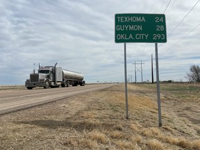 A truck drives on U.S. Highway 64 on the plains of Oklahoma's panhandle region which has yet to report a single case of coronavirus in Guymon, U.S., March 26, 2020. Picture taken March 26, 2020.