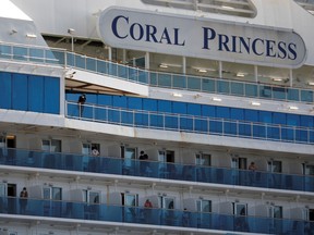 Passengers are seen aboard the Coral Princess ship, of Princess Cruises fleet, with patients affected by coronavirus disease (COVID-19), as it docks at Miami Port, in Miami, Florida, U.S., April 4, 2020.