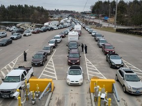 CBSA inspects vehicles and cars crossing over from the U.S.A into Canada on March 19, 2020.