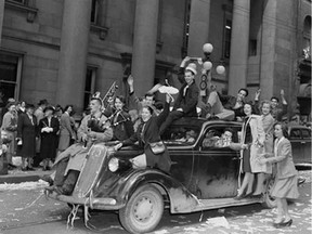 Military personnel and civilians celebrating VE-Day on Sparks Street on May 8, 1945.