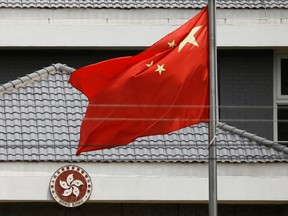 The Chinese flag flutters at the office of the Government of the Hong Kong Special Administrative Region in Beijing on May 25.