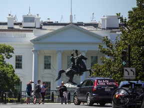 A vehicle with "black lives matter" written on it drives past Lafayette Park outside the White House, during nationwide unrest following the death in Minneapolis police custody of George Floyd, in Washington, D.C., U.S. May 31, 2020.