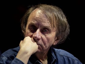 In this file photo taken on April 25, 2019 French writer Michel Houellebecq takes part in a debate "Dialogue in Europe" in Paris.