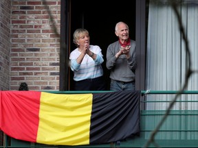 Belgians applaud to celebrate medical personnel dealing with the coronavirus disease (COVID-19), in Brussels, Belgium May 1, 2020.