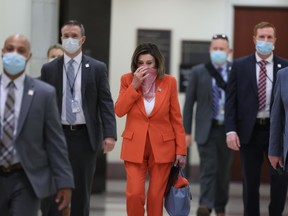 Speaker of the House Nancy Pelosi (D-CA) is surrounded by security and staff as she arrives for her weekly news conference during the novel coronavirus pandemic at the U.S. Capitol April 24, 2020 in Washington, D.C.