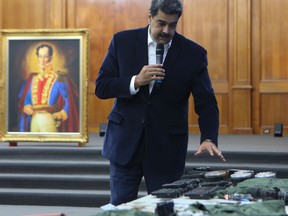 Venezuela's President Nicolas Maduro shows military equipment during a meeting with the Bolivarian armed forces at Miraflores Palace in Caracas, Venezuela May 4, 2020. Picture taken May 4, 2020.