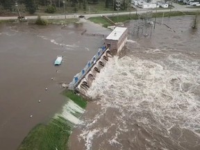 An aerial view of flooding as water overruns Sanford Dam, Michigan, U.S. in this May 19, 2020 still frame obtained from social media video.