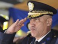 In this Dec. 21, 2012 file photo, Honduras Police Chief Gen. Juan Carlos Bonilla Valladares salutes during an event in Tegucigalpa, Honduras, one year before he was fired on Dec. 19, 2013.