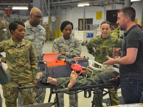 Military personnel get trained to use a portable life-support system at Ramstein Air Base in Germany in 2019.