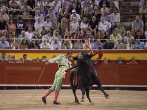 In this photo taken on Friday, Aug. 9, 2019, David Fandila 'El Fandi' makes a pass during a bullfight in the Coliseo Balear bullring in Palma de Mallorca, Spain.