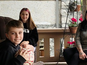 Shelley Fralic has a porch visit with daughter Carly and grandchildren Charley and Sailor.