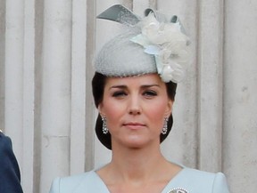 Britain's Catherine, Duchess of Cambridge, stands on the balcony of Buckingham Palace on July 10, 2018 to watch a military fly-past to mark the centenary of the Royal Air Force.