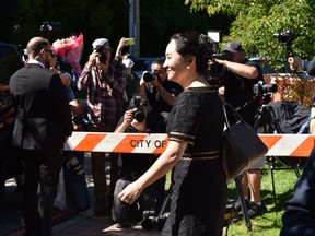 Chinese Huawei tech executive Meng Wanzhou leaves her Vancouver home on May 27, to appear in court.
