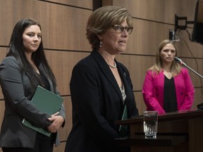 Green Party MP Jenica Atwin (left) and NDP Critic for Diversity and Inclusion and Youth, Women and Gender Equality Lindsay Mathyssen look on as Conservative Women and Gender Quality critic Karen Vecchio speaks during a news conference Thursday May 28, 2020 in Ottawa.