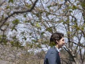 Prime Minister Justin Trudeau returns to Rideau Cottage following a daily briefing with the media in Ottawa, Thursday, May 14, 2020.