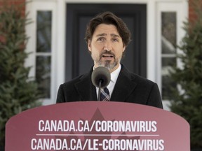 Prime Minister Justin Trudeau delivers his opening statement during a news conference outside Rideau Cottage, Tuesday, May 12, 2020 in Ottawa.