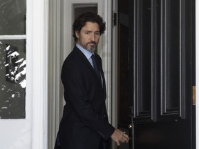 Prime Minister Justin Trudeau steps out of Rideau Cottage as he makes his way to a news conference in Ottawa, Friday May 22, 2020.