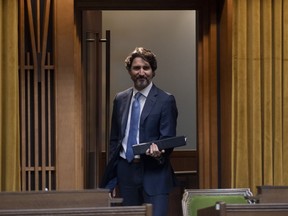 Prime Minister Justin Trudeau enters the Chamber of the House of Commons before a session of the Special Committee on the COVID-19 Pandemic in Ottawa, Wednesday May 13, 2020.