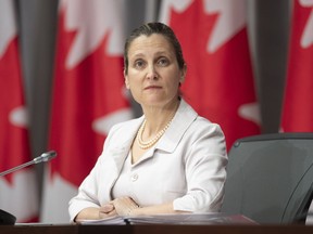 Chrystia Freeland listens to a video conference speaker during a news conference in Ottawa, May 15, 2020.