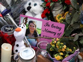 A photograph of Kristen Beaton, who was expecting her third child and was killed along Plains Road during Sunday’s mass shooting, is seen at a makeshift memorial in Debert, Nova Scotia, Canada April 23, 2020.