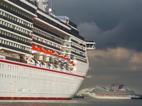 Carnival's Miracle and Panorama cruise ships sit anchored at the Port of Long Beach in California.
