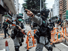 Riot police clear up debris left by protesters attending a pro-democracy rally against a proposed new security law in Hong Kong on May 24, 2020.