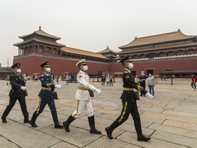 Members of the People's Liberation Army honour guards march past the Wumen Gate of the Forbidden City in Beijing on May 21.