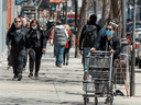 People walk along Ste. Catherine street in Montreal, May 14, 2020.