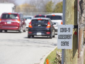 Ten vehicles were lined up when the COVID-19 assessment centre at Oakridge Arena opened this morning in London, Ont. on Thursday April 16, 2020.