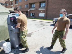Canadian Forces personnel wash up before their break at the Vigi Mount Royal CHSLD seniors residence Tuesday May 26, 2020 in Montreal.
