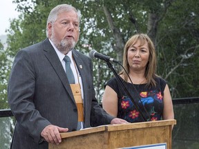 Robert Bertrand, national chief of the Congress of Aboriginal Peoples, addresses a news conference along with Francyne Joe, right, president of the Native Women's Association of Canada, at a meeting of Canadian premiers and Indigenous leaders at Le Pays de la Sagouine, a recreated historic Acadian village, in Bouctouche, N.B. on Wednesday, July 18, 2018. The Congress of Aboriginal Peoples has filed an application in the Federal Court of Canada, challenging the funding allocation of $250,000 it received as part of a COVID-19 fund earmarked for off-reserve Indigenous peoples.