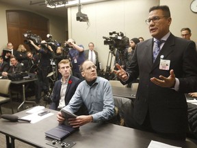 Onekanew (Chief) at Opaskwayak Cree Nation, Christian Sinclair, asks Manitoba Premier Brian Pallister a question during the announcement of the Manitoba plan for cannabis retail and distribution at the Manitoba Legislature in Winnipeg, Tuesday, November 7, 2017. The chief of a Manitoba First Nation says he is disheartened after four members were charged with fraud.