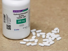 This file photograph taken on May 20, 2020, shows a bottle and pills of Hydroxychloroquine as they sit on a counter at Rock Canyon Pharmacy in Provo, Utah. - The French Medicines Agency announced on May 26, 2020, that it had "launched" the procedure for suspending "as a precaution" the inclusion of new patients in clinical trials evaluating hydroxychloroquine in the treatment of Covid-19, following the WHO's decision after the publication of an unfavourable study.