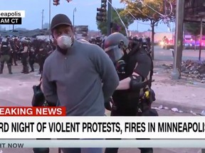 A screengrab of police arresting CNN reporter Oscar Jimenez while he was reporting live on air during the Minneapolis riots, May 29, 2020.