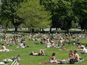 Despite the fact that outdoor areas pose less risk of spreading COVID-19, crowded public beaches, like Kitsilano Beach Park in Vancouver, are a different story, says Dr. Ali S. Raja.