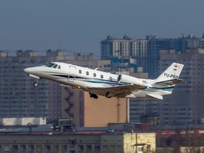 A private jet descends before landing at the Pulkovo Airport, in Saint Petersburg, Russia, March 6, 2020.