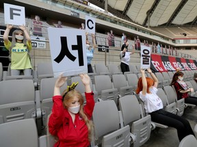 Mannequins are placed in spectator seats to cheer South Korea's football club FC Seoul team during a match against Gwangju FC, which is held without fans due to the COVID-19 outbreak, in Seoul, South Korea, May 17, 2020.