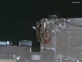 A satellite image shows the Iranian vessel Konarak, centre, which was damaged in a friendly-fire missile incident at the Jask port, in southern Hormozgan province, Iran, on May 11, 2020.