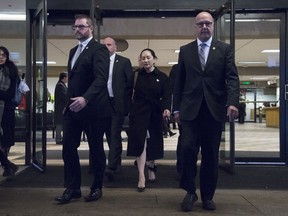 Meng Wanzhou, chief financial officer of Huawei, leaves B.C. Supreme Court in Vancouver on January 23, 2020. A former ambassador to China says tomorrow's decision in the extradition case of Huawei exective Meng Wanzhou could also determine the fate of two Canadians detained in China. David Mulroney, who served as Canada's ambassador to the People's Republic of China between 2009 to 2012, says if Meng is released then he expects China will eventually follow suit and release Michael Kovrig and Michael Spavor.