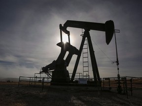 A pumpjack works at a well head on an oil and gas installation near Cremona, Alta., on October 29, 2016. Representatives from Canada's oil patch say they don't know of a single energy company that has yet benefited from any of Ottawa's COVID-19 inspired loan programs.THE CANADIAN PRESS/Jeff McIntosh