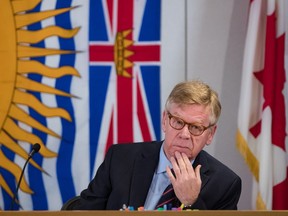 Commissioner Austin Cullen listens to introductions before opening statements at the Cullen Commission of Inquiry into Money Laundering in British Columbia, in Vancouver, on February 24, 2020. Money laundering in British Columbia will be under scrutiny again this week when a public inquiry resumes today. Over the next 3 1/2 weeks, expert witnesses ranging from academics to police officers are expected to shed light on how dirty money is quantified and the regulatory models that are being used to fight it around the globe. The B.C. government called the inquiry amid growing concern that illegal cash was helping fuel its real estate, luxury car and gambling sectors.